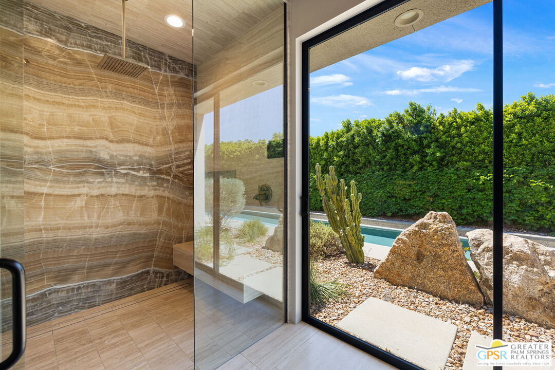 1 Sterling Ridge Drive Rancho Mirage, CA 92270 - Photo 34 of 51 a view of a glass door and porch