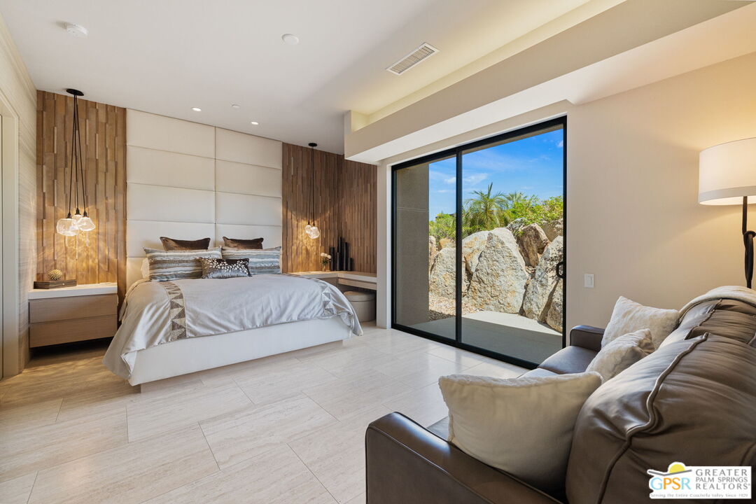 1 Sterling Ridge Drive Rancho Mirage, CA 92270 - Photo 42 of 51 a bedroom with a bed and a large window