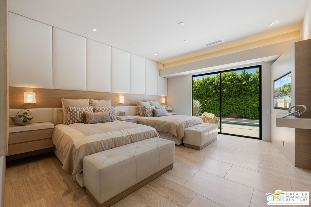 1 Sterling Ridge Drive Rancho Mirage, CA 92270 - Photo 44 of 51 a spacious bedroom with a bed and large window
