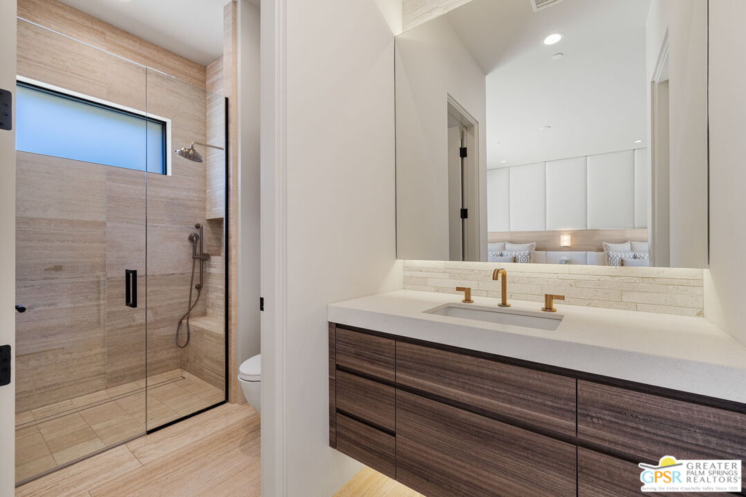 1 Sterling Ridge Drive Rancho Mirage, CA 92270 - Photo 45 of 51 a bathroom with a double vanity sink mirror and shower