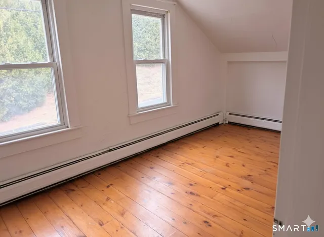 a view of an empty room with a window