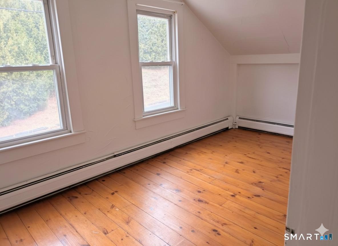71 Bridge Street Canton, CT 06019 - Photo 5 of 6 a view of an empty room with a window