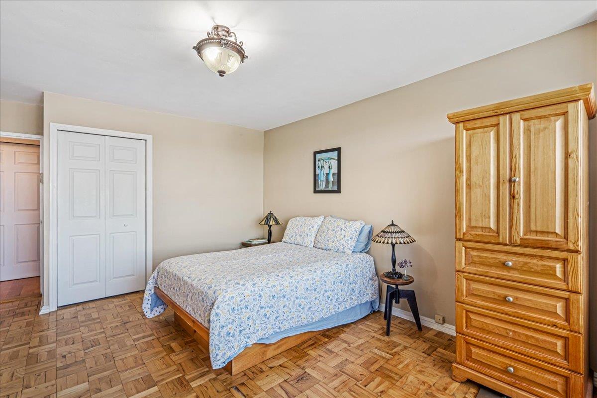 17-85 215th Street, Unit 12S Queens, NY 11360 - Photo 17 of 37 Bedroom with a closet and baseboards