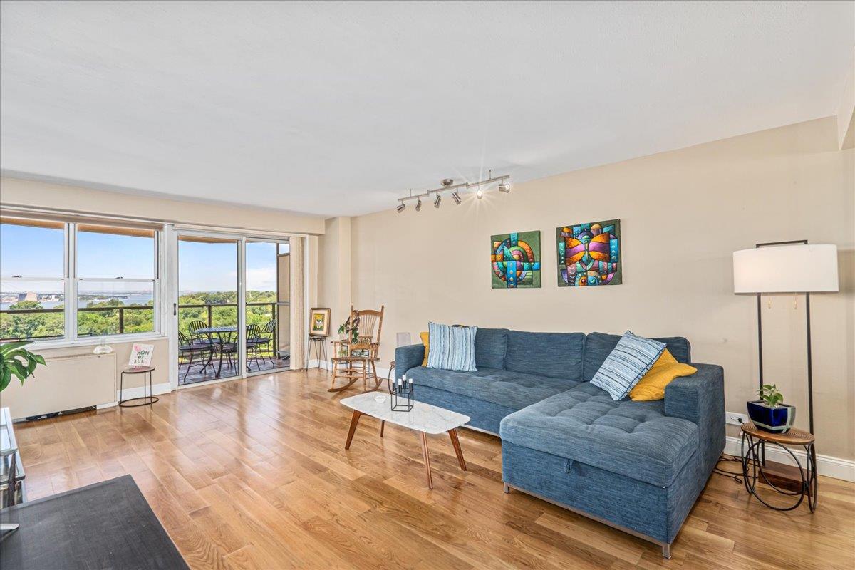 17-85 215th Street, Unit 12S Queens, NY 11360 - Photo 3 of 37 Living area featuring light wood-style floors and track lighting