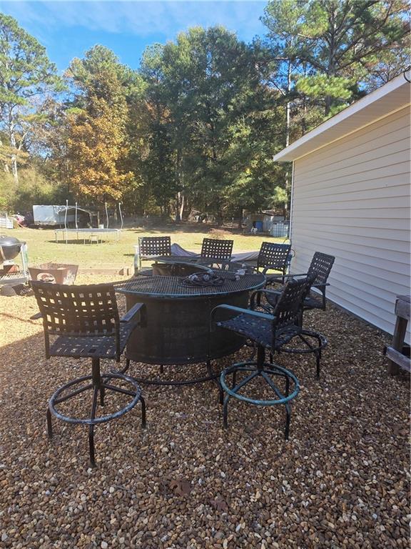 176 Runyon Loop Cedartown, GA 30125 - Photo 19 of 20 a view of a backyard with sitting area