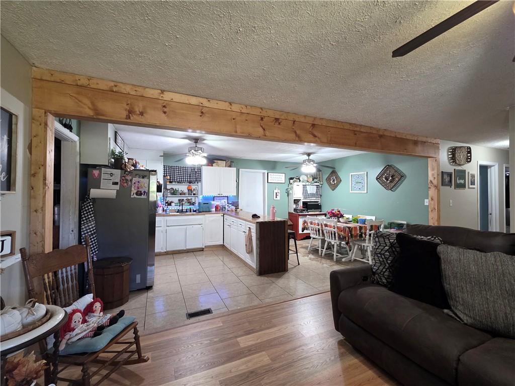 176 Runyon Loop Cedartown, GA 30125 - Photo 4 of 20 a living room with furniture and kitchen view
