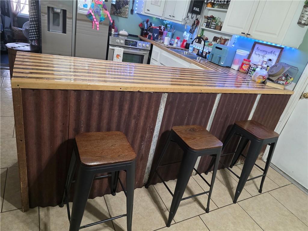 176 Runyon Loop Cedartown, GA 30125 - Photo 7 of 20 a view of dinning table and chairs in the kitchen