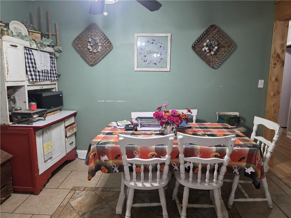 176 Runyon Loop Cedartown, GA 30125 - Photo 8 of 20 a dining room with a table chairs and a dining table