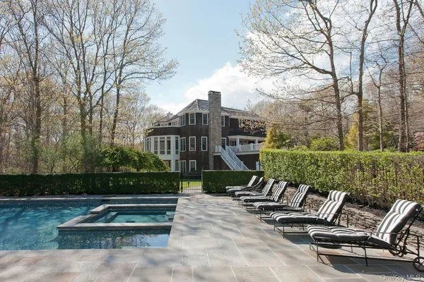 a view of a bench in a backyard