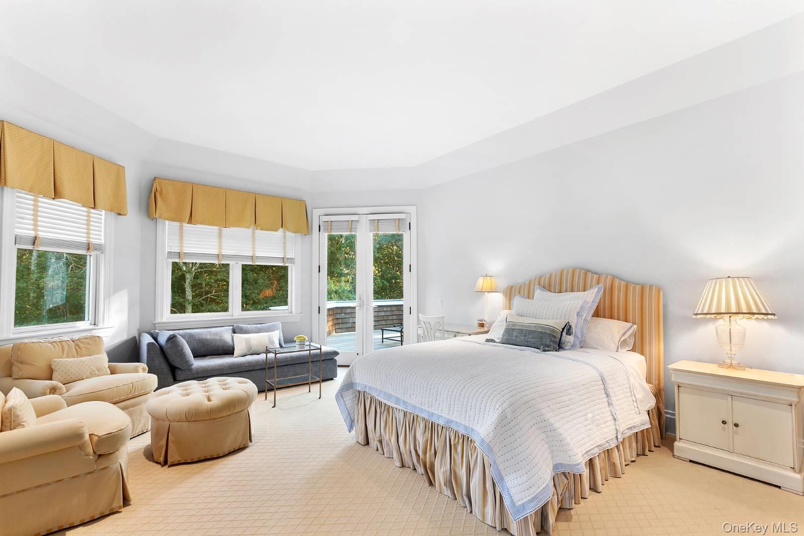 1477 Deerfield Road Water Mill, NY 11976 - Photo 8 of 17 a bedroom with bed couch and window