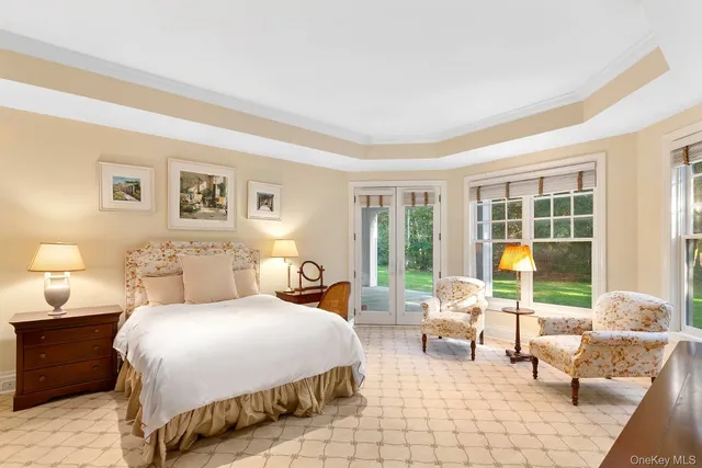 a bedroom with double bed and a large window