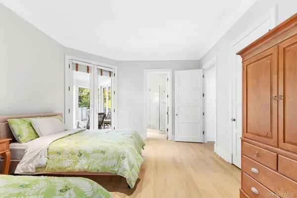 a spacious bedroom with a bed and a window