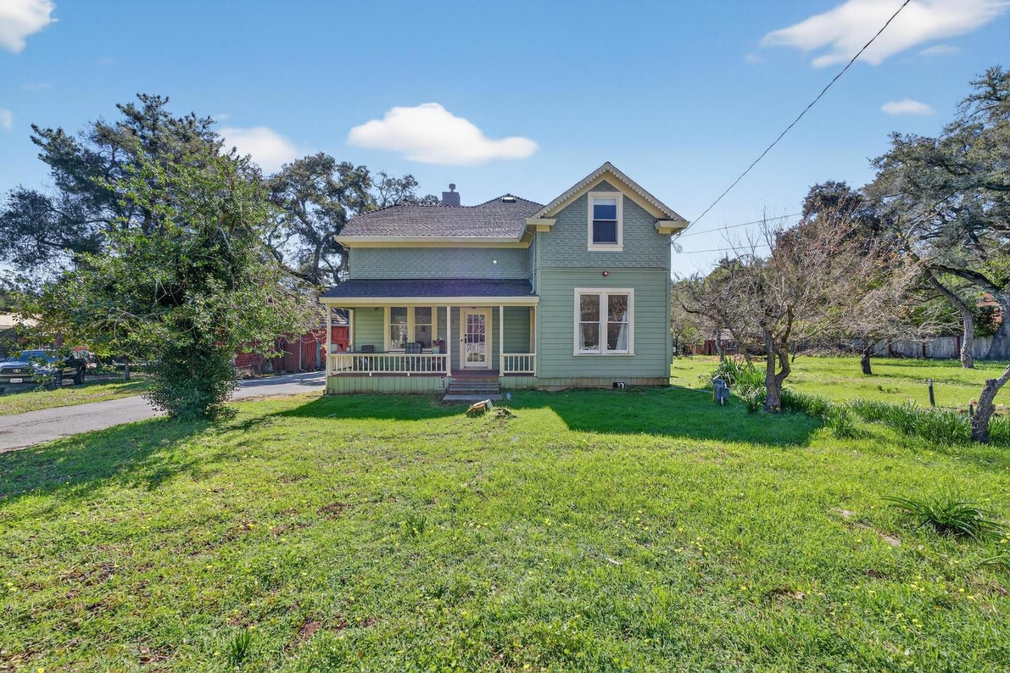 a front view of house with yard and green space