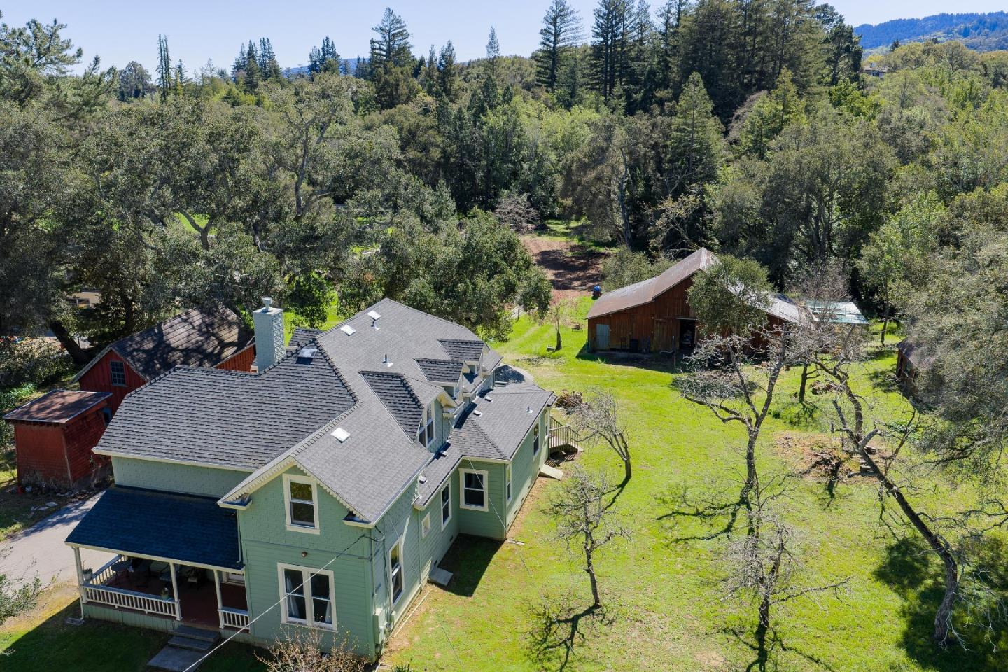 3215 Woodside Road Woodside, CA 94062 - Photo 7 of 24 an aerial view of a house with swimming pool and large trees
