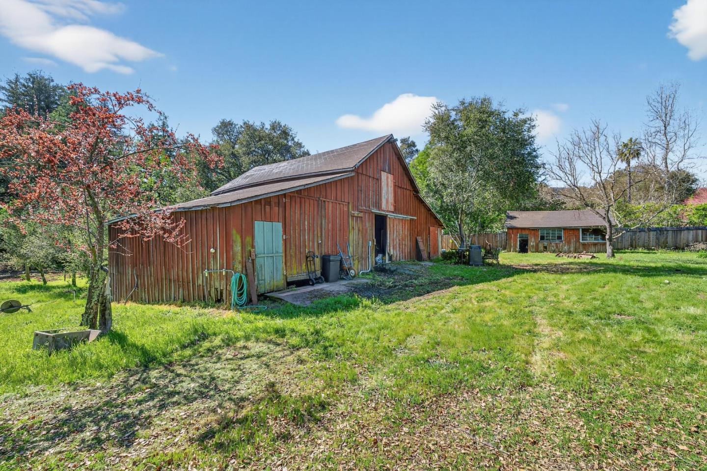 3215 Woodside Road Woodside, CA 94062 - Photo 9 of 24 a view of a house with backyard and garden