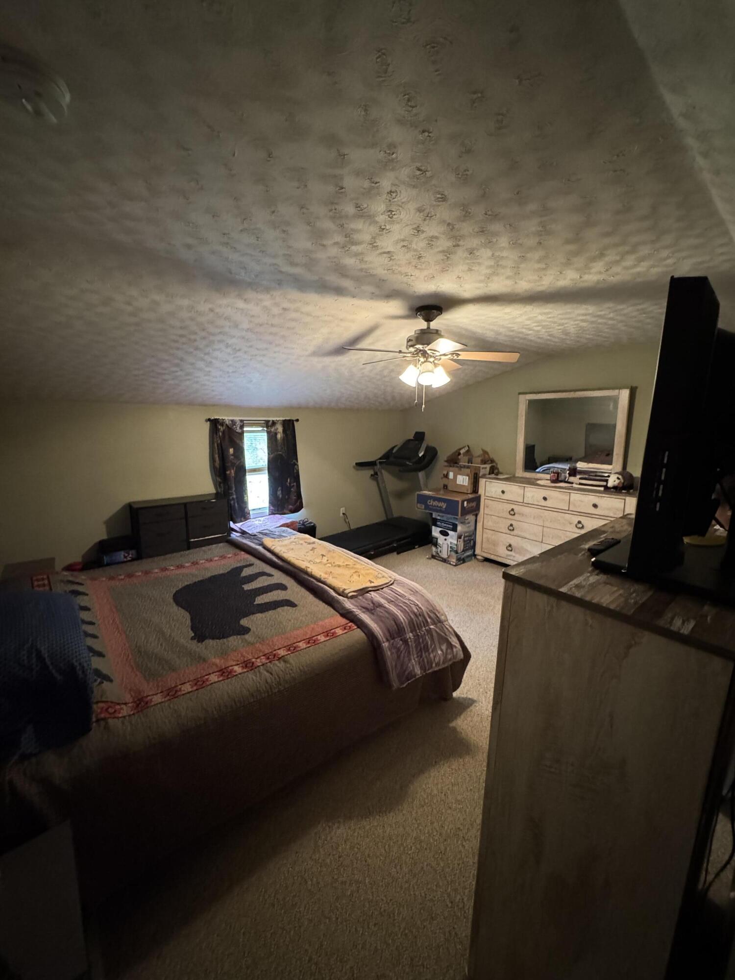 7150 Mill Branch Road Covington, VA 24426 - Photo 15 of 29 a bed sitting in a bedroom next to a window