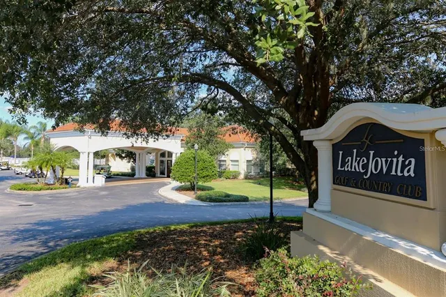 a view of sign board with flower around