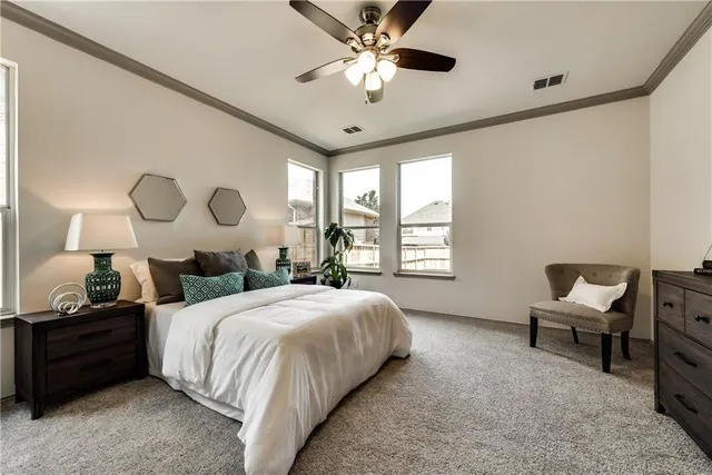 a bedroom with a bed and window