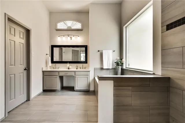 a kitchen with a sink and a stove top oven