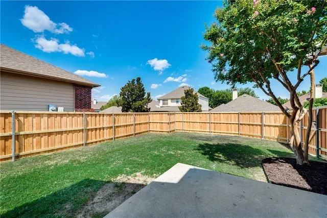 a view of a backyard with a garden