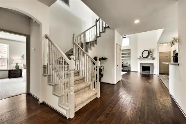 a view of entryway and hall with wooden floor