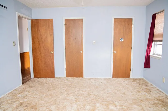 a view of a room with a wardrobe space