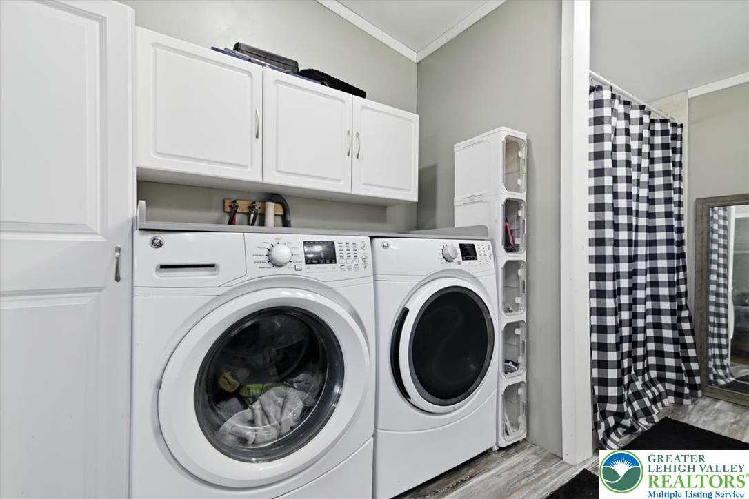 634 Main Road Lehighton, PA 18235 - Photo 23 of 39 Functional laundry space featuring modern appliances and clever storage solutions.