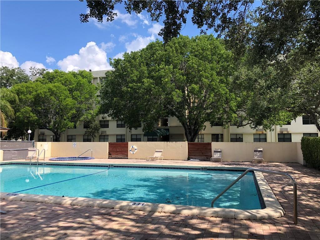 2501 Riverside Drive, Unit 218 Coral Springs, FL 33065 - Photo 13 of 15 a view of a house with a yard