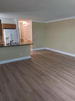 2501 Riverside Drive, Unit 218 Coral Springs, FL 33065 - Photo 5 of 15 a view of room with wooden floor and cabinet