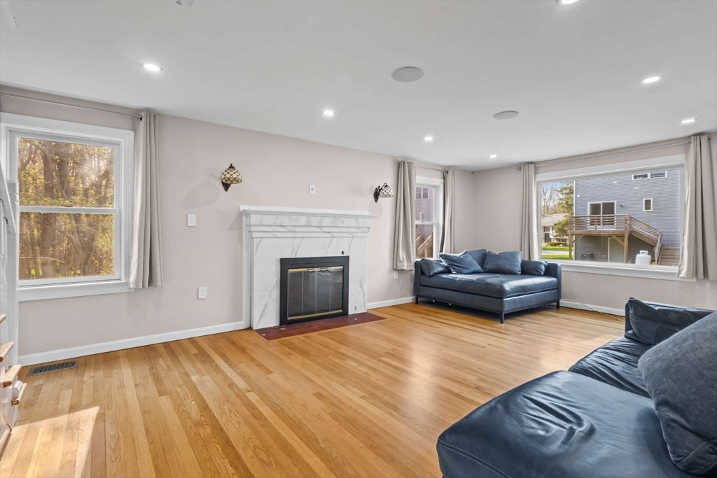 7 Darrow Street Worcester, MA 01606 - Photo 8 of 42 a living room with furniture and a fireplace