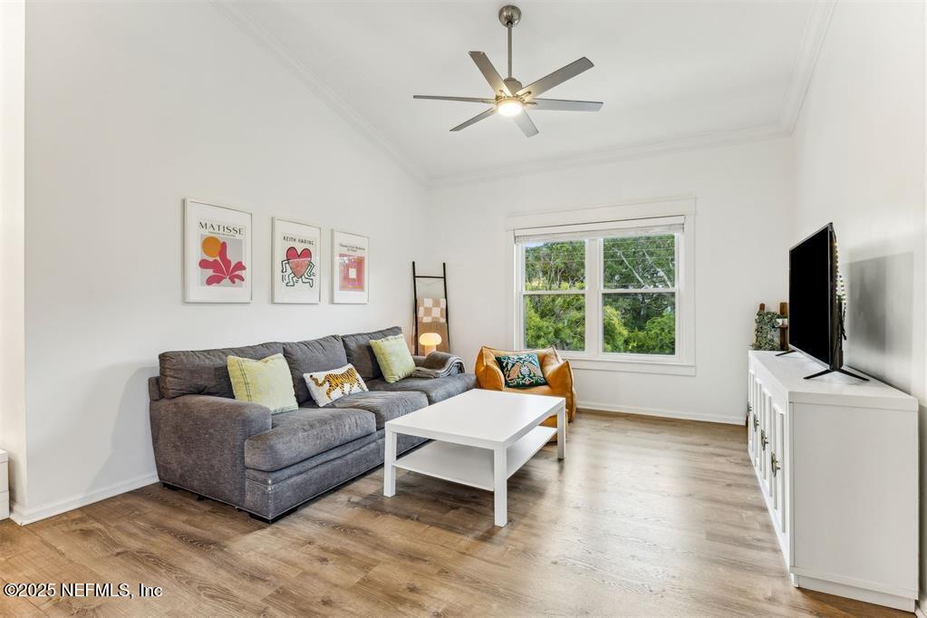 1601 Nectarine Street, Unit I5 Fernandina Beach, FL 32034 - Photo 12 of 22 a living room with furniture and a flat screen tv