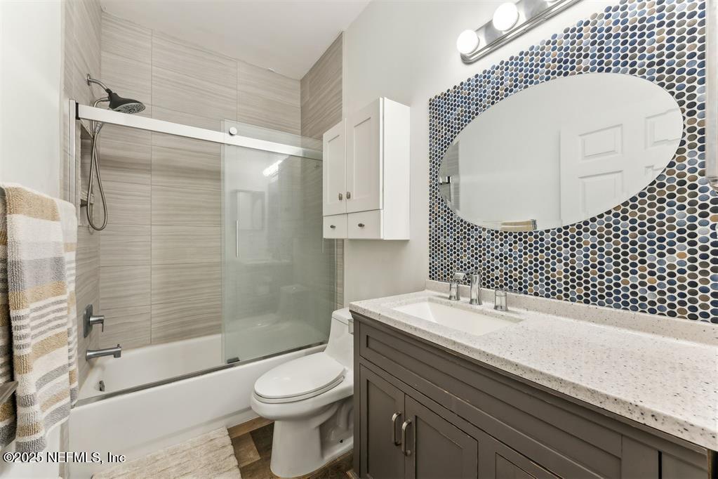 1601 Nectarine Street, Unit I5 Fernandina Beach, FL 32034 - Photo 16 of 22 a bathroom with a sink a toilet and shower