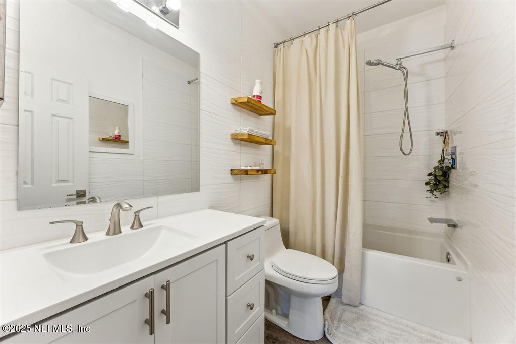 1601 Nectarine Street, Unit I5 Fernandina Beach, FL 32034 - Photo 5 of 22 a bathroom with a sink toilet and shower