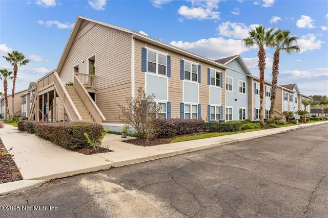 a view of a chairs and table in the patio