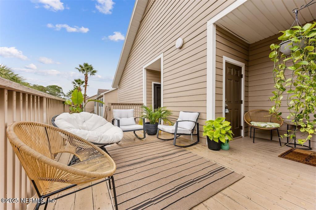 1601 Nectarine Street, Unit I5 Fernandina Beach, FL 32034 - Photo 10 of 22 a view of a chairs and table in the patio