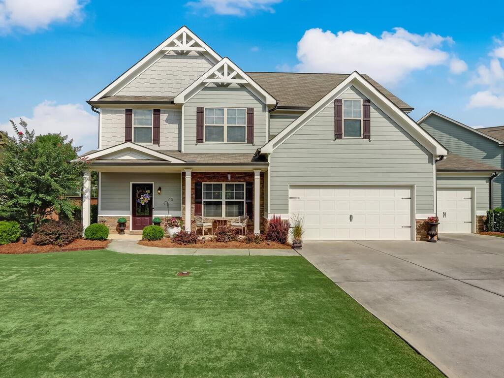 200 Porter Place Jefferson, GA 30549 - Photo 1 of 1 a front view of a house with sitting area and garden