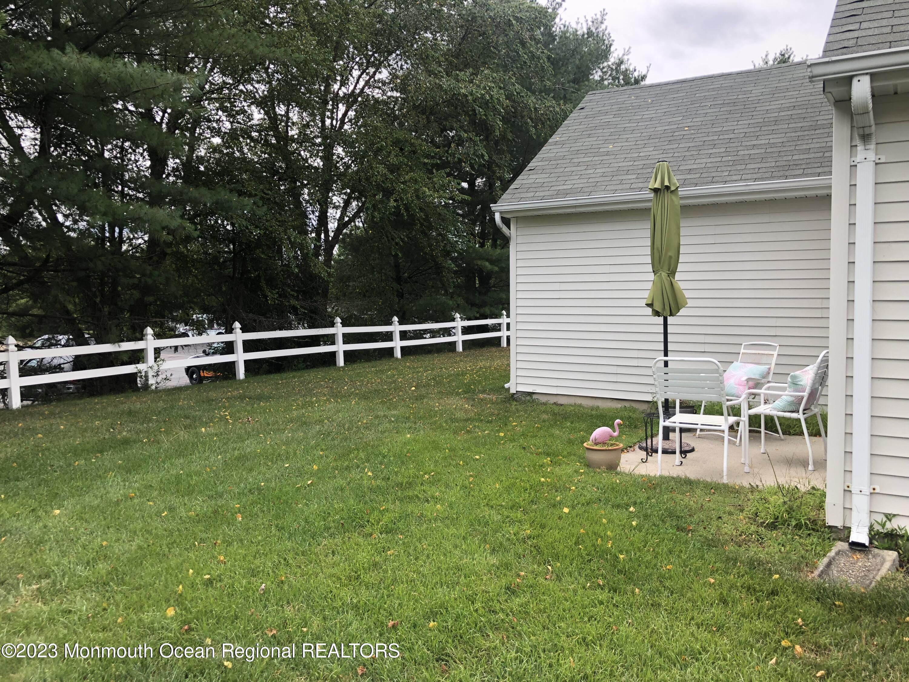32 Meadows Lane Whiting, NJ 08759 - Photo 11 of 12 a view of a house with backyard and sitting area