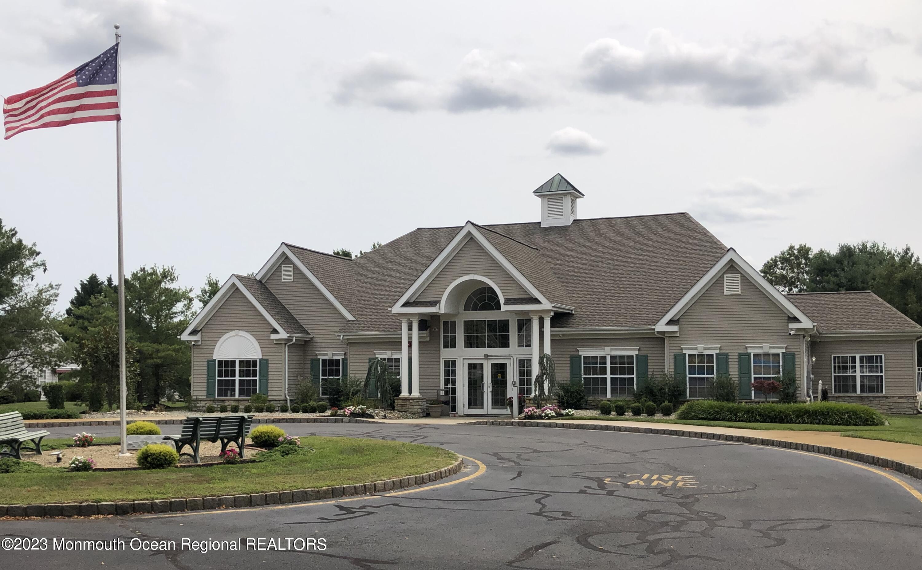 32 Meadows Lane Whiting, NJ 08759 - Photo 12 of 12 a front view of a house with garden