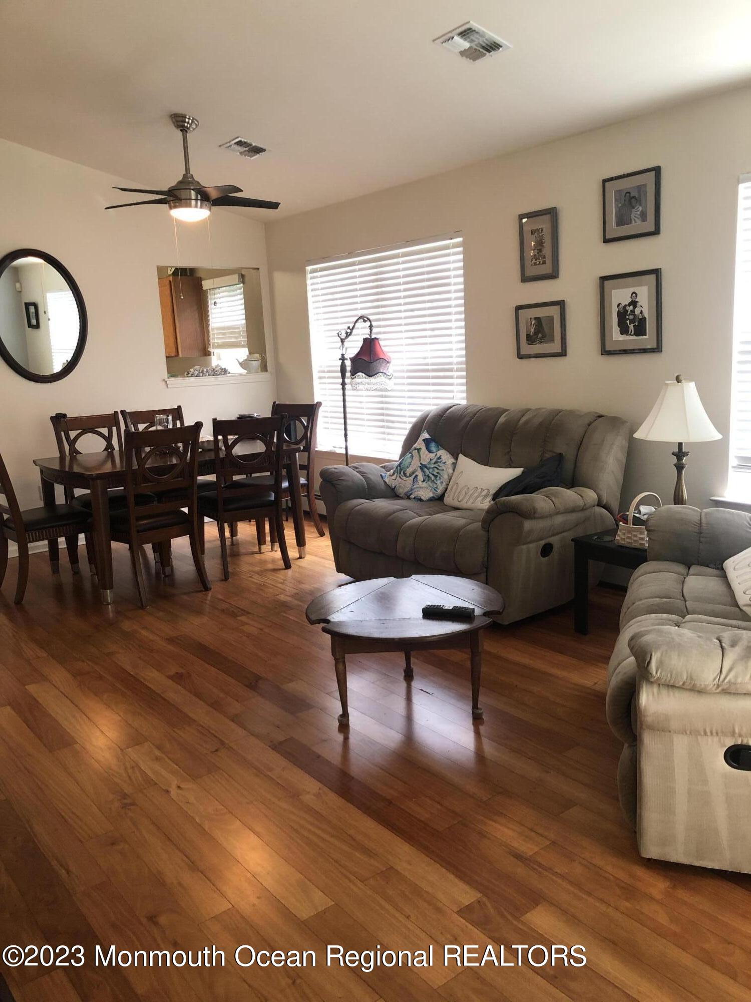32 Meadows Lane Whiting, NJ 08759 - Photo 2 of 12 a living room with furniture a dining table and a large window