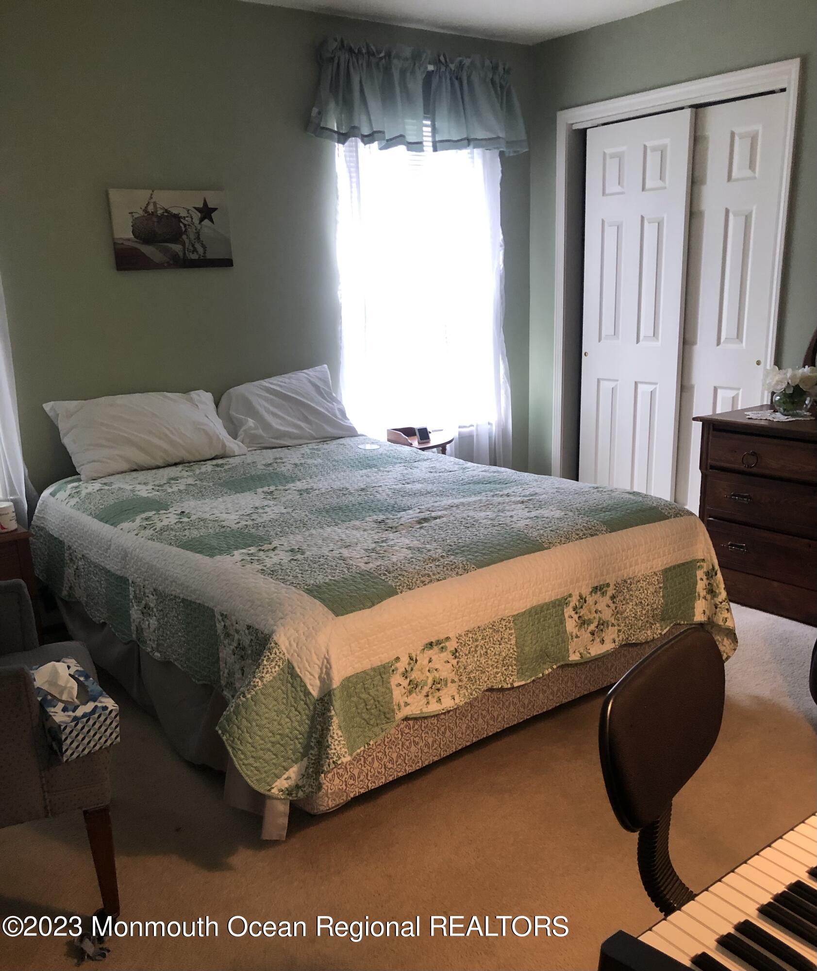 32 Meadows Lane Whiting, NJ 08759 - Photo 6 of 12 a bedroom with a bed and a window