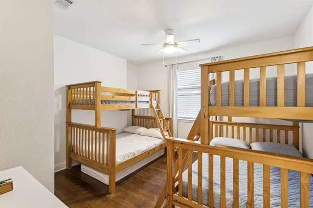 a bedroom with furniture and a window