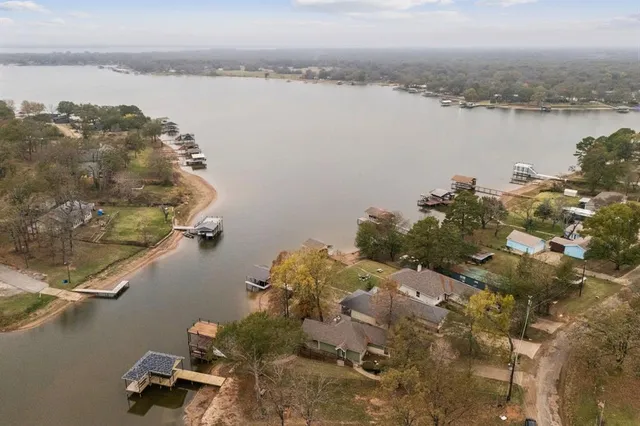 a aerial view of a house with a yard