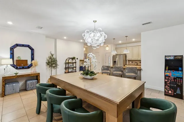 a kitchen with a table and chairs