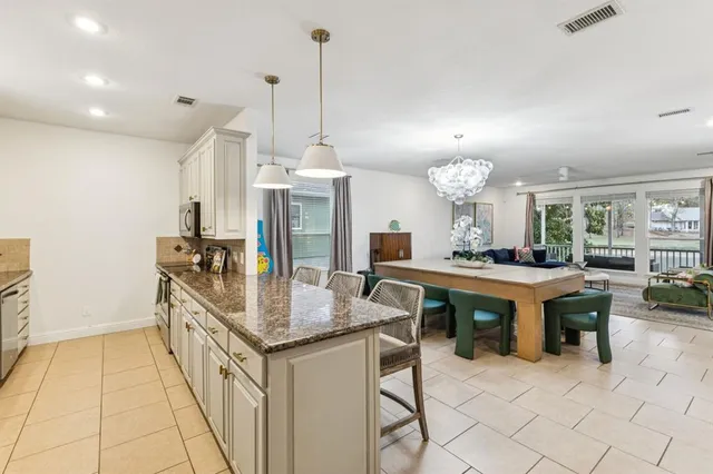 a kitchen with kitchen island granite countertop lots of counter top space