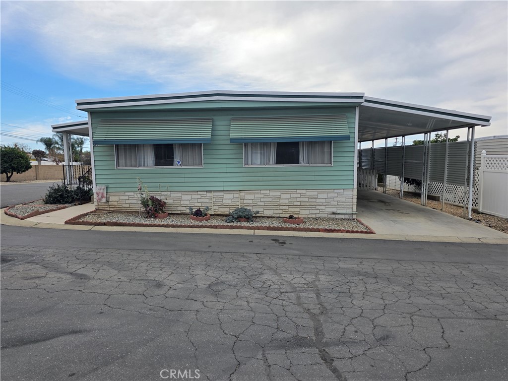 12700 2nd Street, Unit 35 Yucaipa, CA 92399 - Photo 1 of 15 a view of a house with backyard