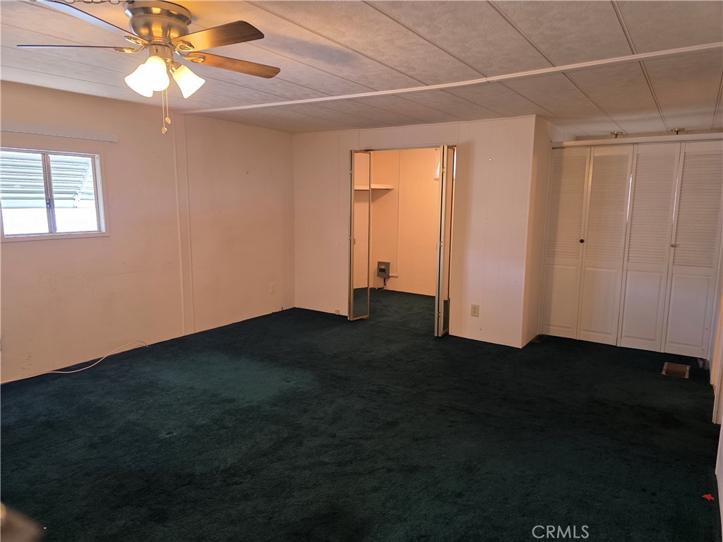 12700 2nd Street, Unit 35 Yucaipa, CA 92399 - Photo 12 of 15 a view of empty room with wooden floor and fan