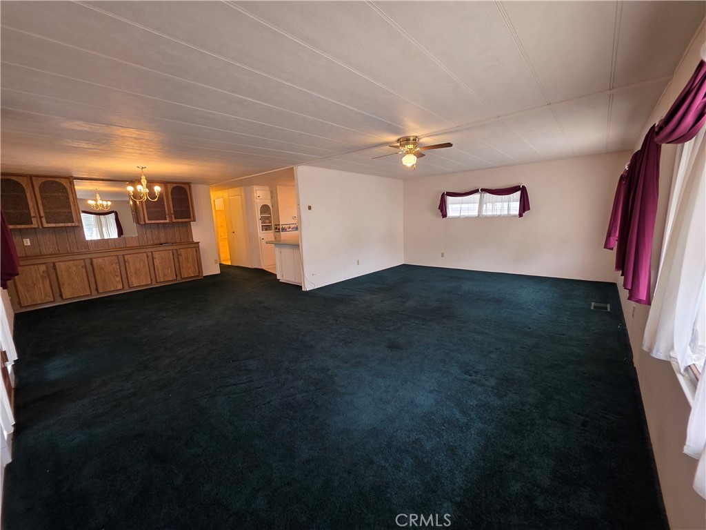 12700 2nd Street, Unit 35 Yucaipa, CA 92399 - Photo 5 of 15 a view of a livingroom with furniture hardwood floor and a ceiling fan