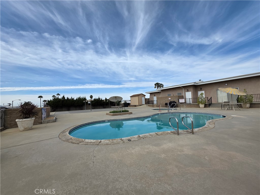 12700 2nd Street, Unit 35 Yucaipa, CA 92399 - Photo 6 of 15 a view of swimming pool with outdoor seating and yard in back
