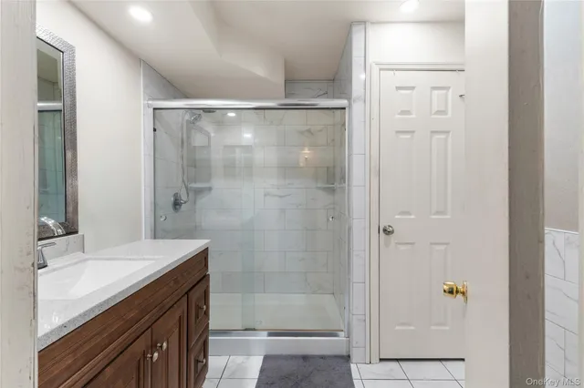 a bathroom with a shower and a sink