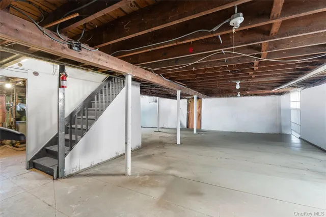 a view of an empty room with stairs